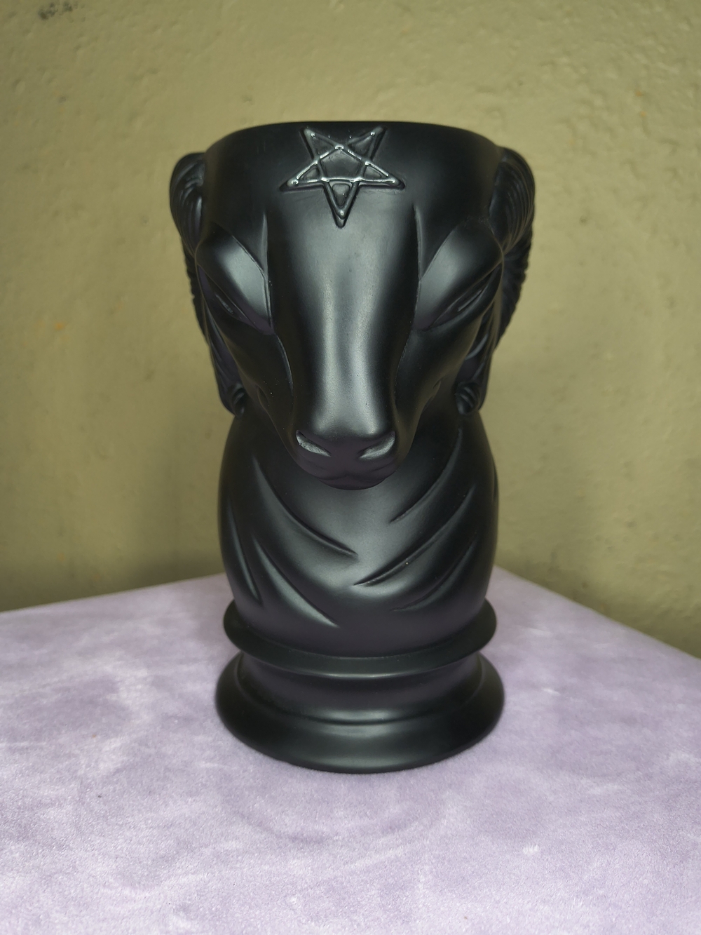 Killstar Levi resin vase with a matte black finish and a statement ram